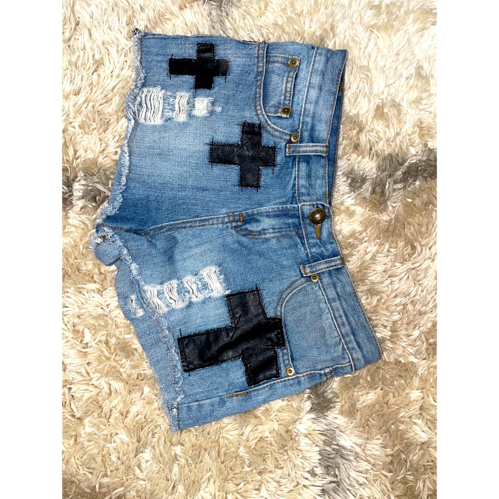 Mid rise Denim shorts with cross appliqué